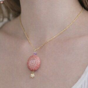 Patch & Roam pink fossilized coral pendant necklace with floral bead detail